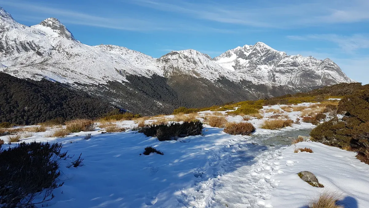 Snow on the Key Summit track with peaks beyond, a walk on a Milford Sound cruise day from Te Anau